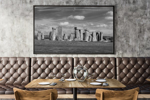 Stonehenge monuments rise above open grassland in England.