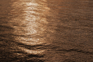 Warm sunset reflection on coastal Alaskan waters