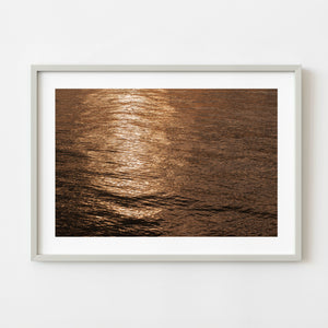 Sunlit ocean ripples photographed from a small plane