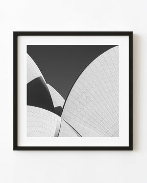 Overlapping Sydney Opera House roof curves and tiled surfaces in black and white.