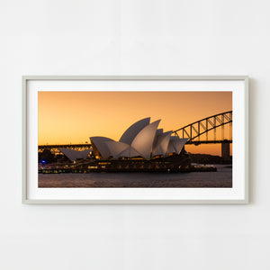 Sydney Opera House glowing at sunset