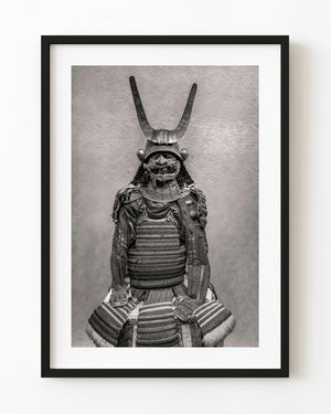 Samurai armour with a tall crescent helmet crest and bearded face mask in black and white.
