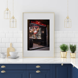 Hanging sausages and cured hams fill the warmly illuminated Tasca El Corral interior.