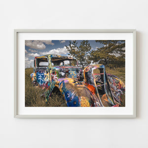 Graffiti covered vintage car at Bug Ranch Texas