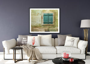 Evocative image of a traditional Romanian window, framed by historic wall textures.