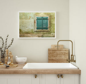 Detailed shot of a Romanian wall's aged textures and muted color palette.