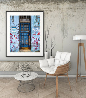 Urban decay blue door with graffiti