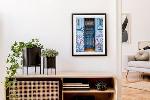 Graffiti on old blue door in London