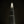 Bright pointed glass crown of The Shard rises above scattered office lights.
