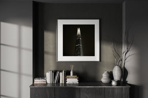 London night photograph with The Shard isolated against broad dark sky.