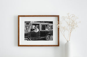 Mysore documentary photograph with faces framed by old vehicle windows.