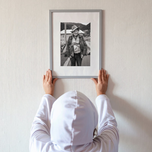 Black and white portrait of a travelling Tibetan man