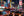 Times Square night traffic with yellow cabs and a city bus