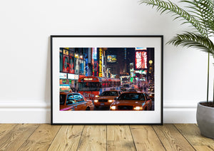 Colourful billboards above taxis in Times Square, New York City