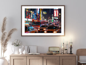 New York City bus and taxis in Times Square after dark