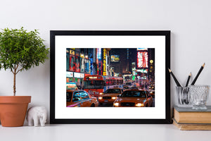 Night street scene with yellow taxis in Times Square