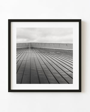 Converging metal facade lines at the Titanic Museum in black and white