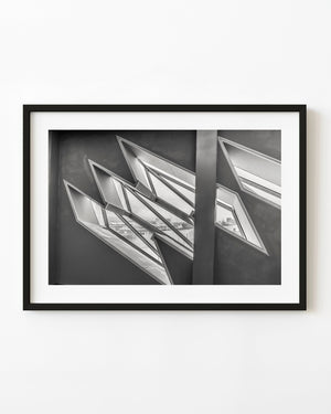 Angular windows inside the Titanic Museum in black and white