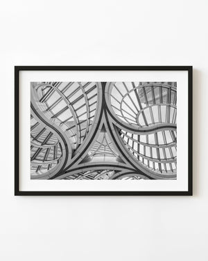 Curving glass roof and sweeping structural ribs in Tokyo, black and white