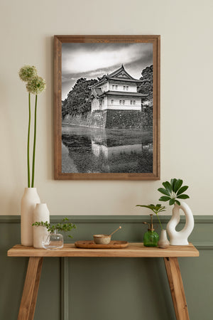 Tokyo palace guardhouse reflected beneath a cloudy sky