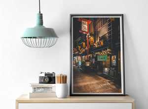 Warm light illuminating a quiet izakaya street in Tokyo