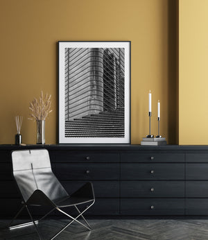 Repeating roof tiles and gridded glass in a monochrome Tokyo cityscape