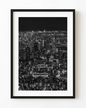 Tokyo’s Sumida River bridges and city lights at night in black and white
