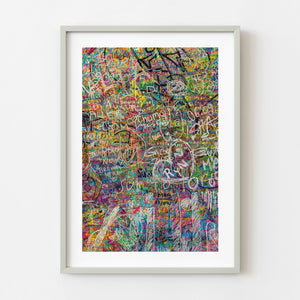 Colorful layered graffiti wall in Tokyo stairwell filled with abstract tags and paint