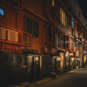 Urban Tokyo side street with illuminated doorways