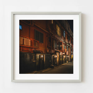 Tokyo night alley with warm architectural lighting