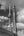 CN Tower rising behind the Power Plant smokestack in Toronto