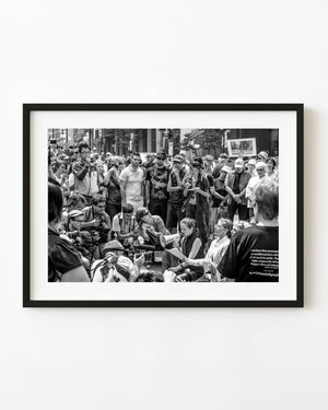 Toronto G20 protest crowd gathered around a speaker with a megaphone in black and white