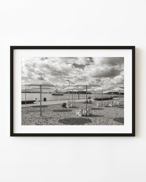 Toronto HTO Park beach with umbrellas, Adirondack chairs and harbour views in black and white