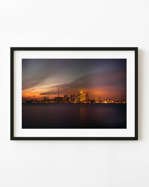Toronto skyline from Ward’s Island beneath a glowing orange evening sky