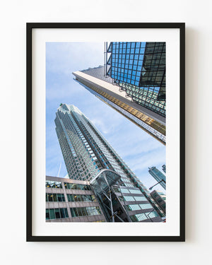 Toronto skyscrapers and blue glass facades viewed upward against the sky
