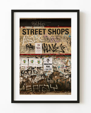 Toronto Street Shops wall covered in graffiti and torn advertisements