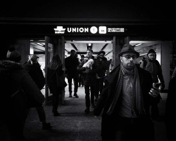 Busy evening rush captured in black and white at Toronto's subway