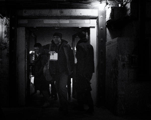 Shadowy figures moving through the construction of Union Station's gritty tunnels