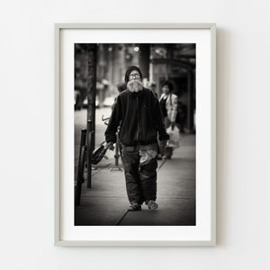 Bearded man walking in Toronto black and white