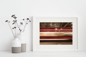 Action shot of train racing by station