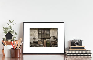 Rustic Transylvanian farmhouse wall with lace curtains and weathered wooden details.