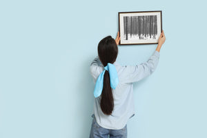 Winter woodland with young saplings and deep snow cover
