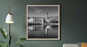 Rippling reflections of Trogir cathedral and waterfront buildings in Croatia.
