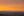Layered hills and quiet fields in Tuscany under golden-orange evening light.