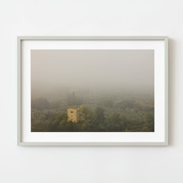 Tuscan buildings in fog