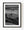 Small Tuscan chapel and farmhouse among rolling fields in black and white.