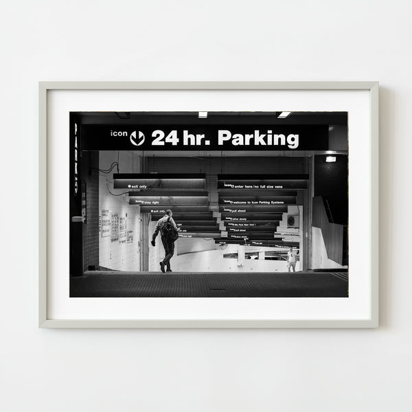 Two men walking down parking ramp New York | Photo Art Print