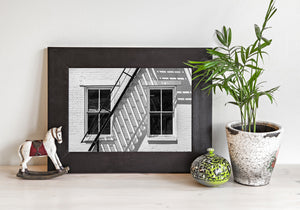 Interior view of room with city texture wall art above sofa