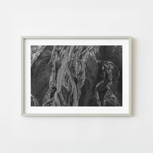 Aerial view of braided river channels on the Alaska Coast in monochrome