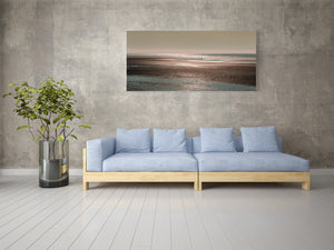 Low tide coastal scene in Alaska with brown bears crossing wet sand